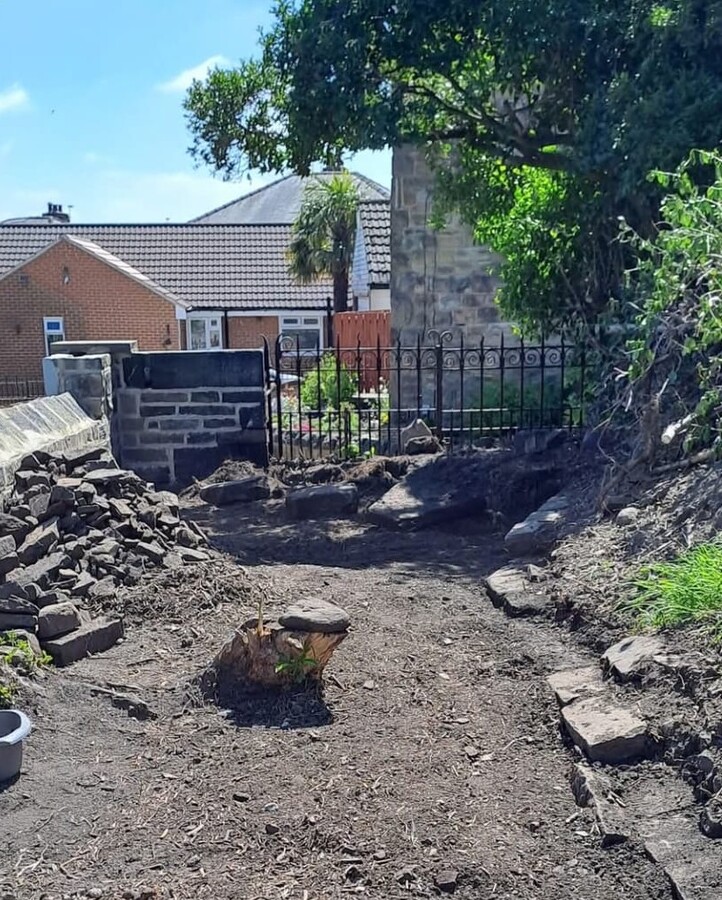 TASK5 a large overgrown privet hedge too close to the existing wall at the far end, and overhanging the gate was cut down 